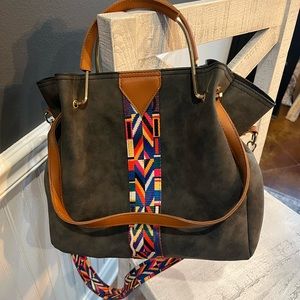 Purse with guitar strap.